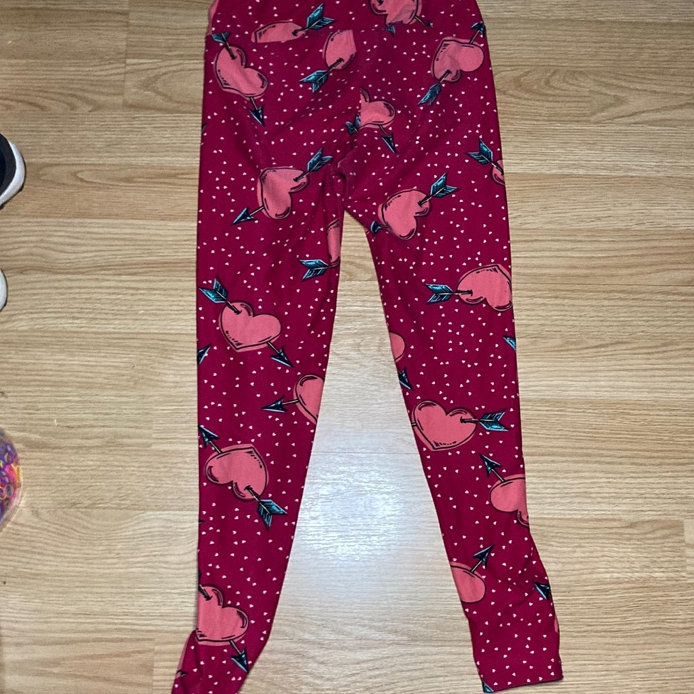 LuLa roe leggings they are one size fits all the color is red/pink.